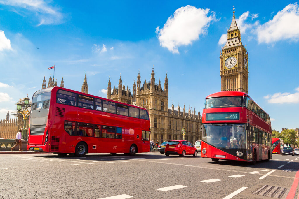 Red double-decker buses in front of Big Ben in London