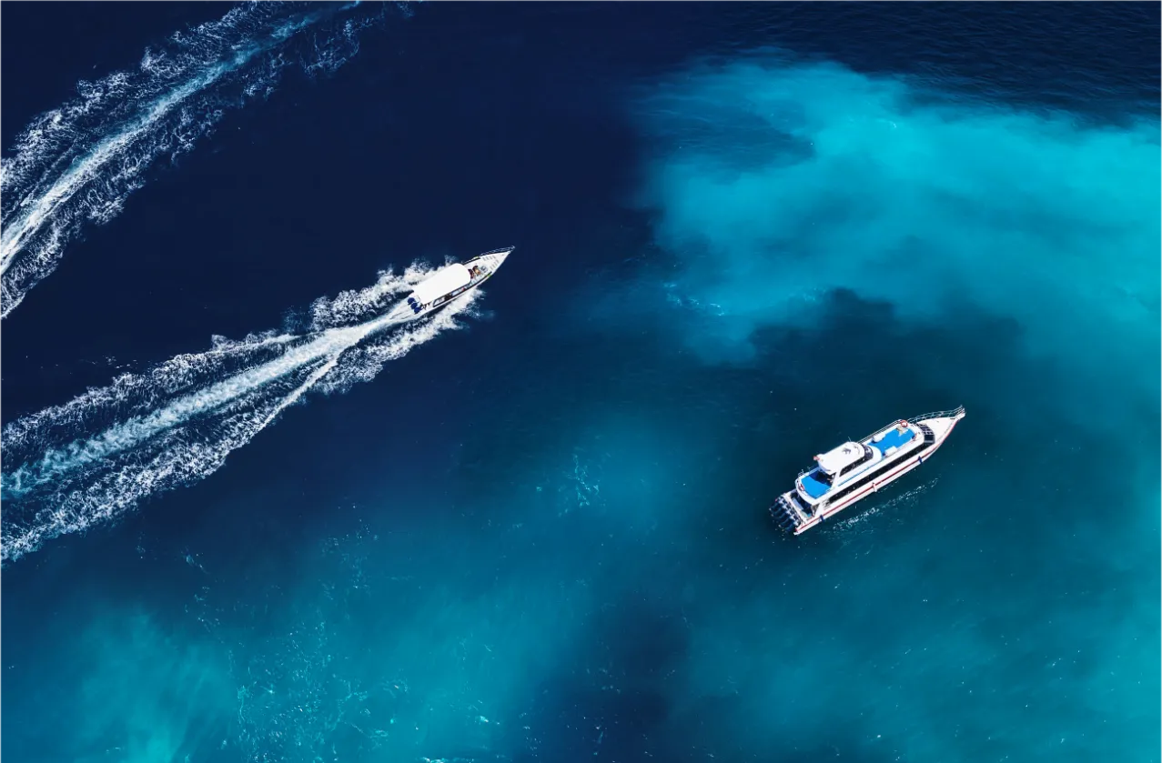 Boats on a clear blue ocean